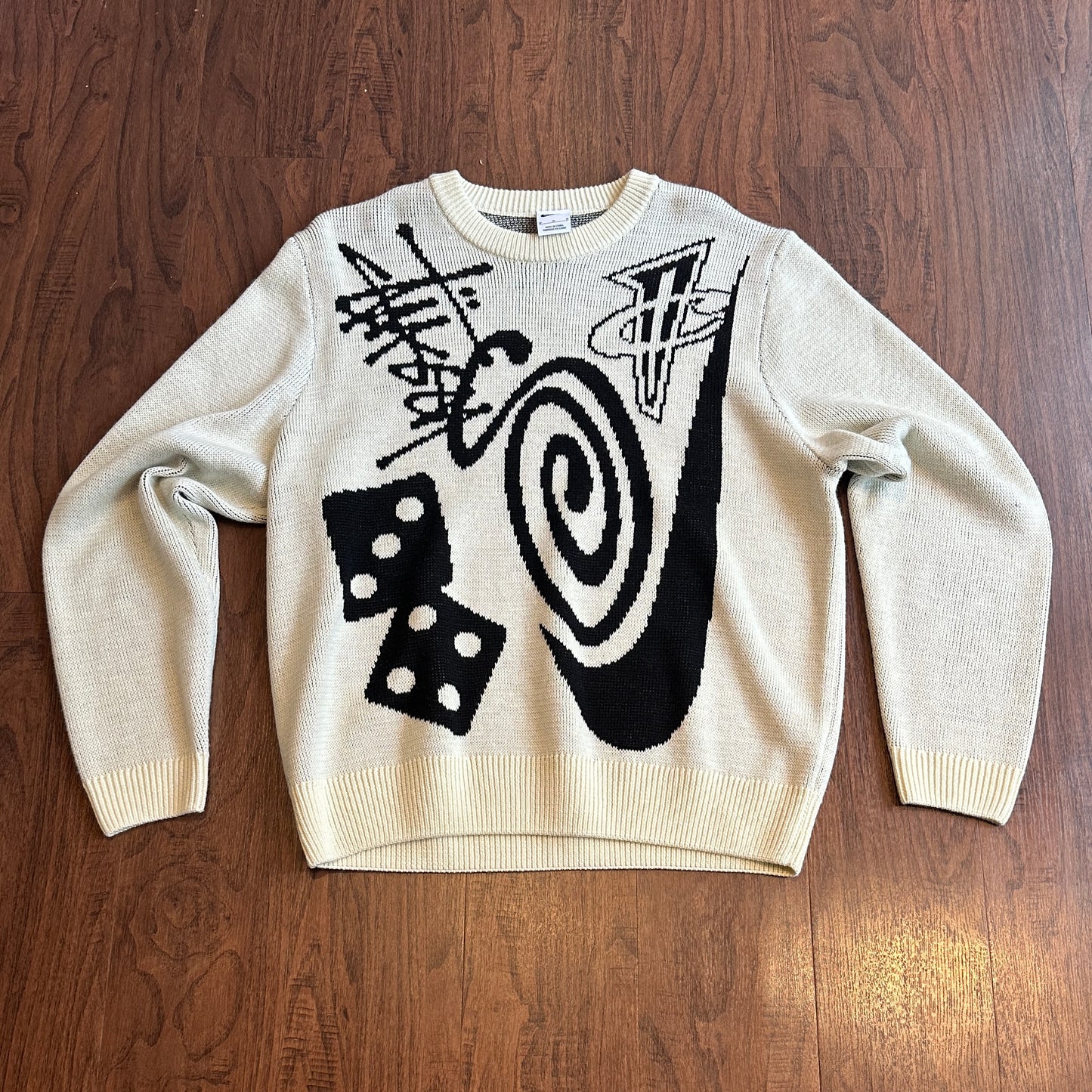This Nike Stussy crewneck sweater is a soft, lightweight must-have. Crafted with cozy yet stylish knit fabric, this crewneck will keep you comfortable and looking sharp all day. Step out and make a statement in this timeless classic.