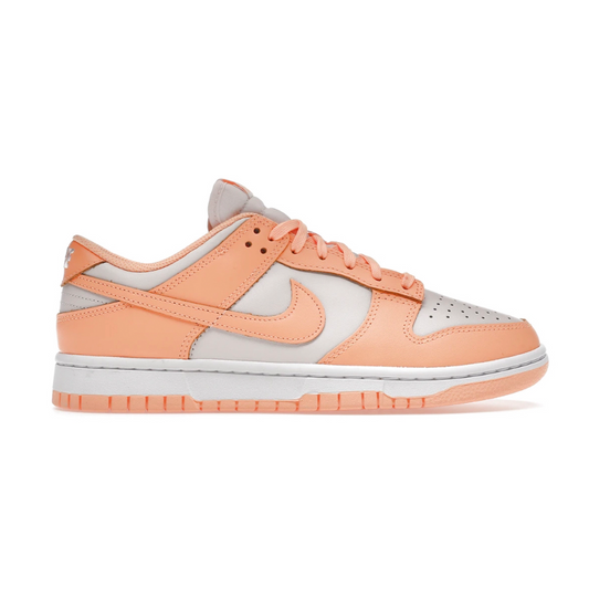 Achieve a fashionable look with Nike Dunk Low Peach Cream! This stylish, low-cut sneaker showcases the perfect blend of comfort and style with its breathable mesh and leather upper. With its crisp design, this sneaker is sure to make a statement! Be bold and make a statement with the Nike Dunk Low Peach Cream!