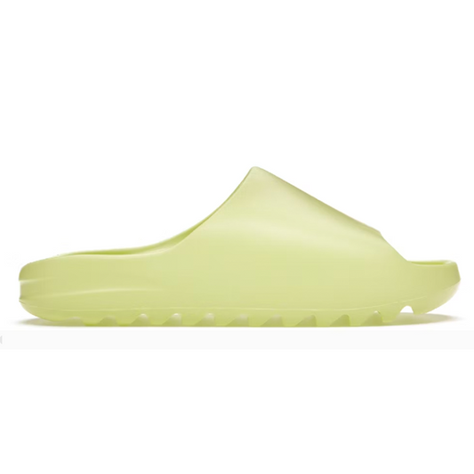 Yeezy's Glow Green Slide is the perfect balance of comfort and style. With its unique design and signature Yeezy touch, you can rest assured you'll look great while feeling cozy. Enjoy the lightweight steps and be the envy of your friends.