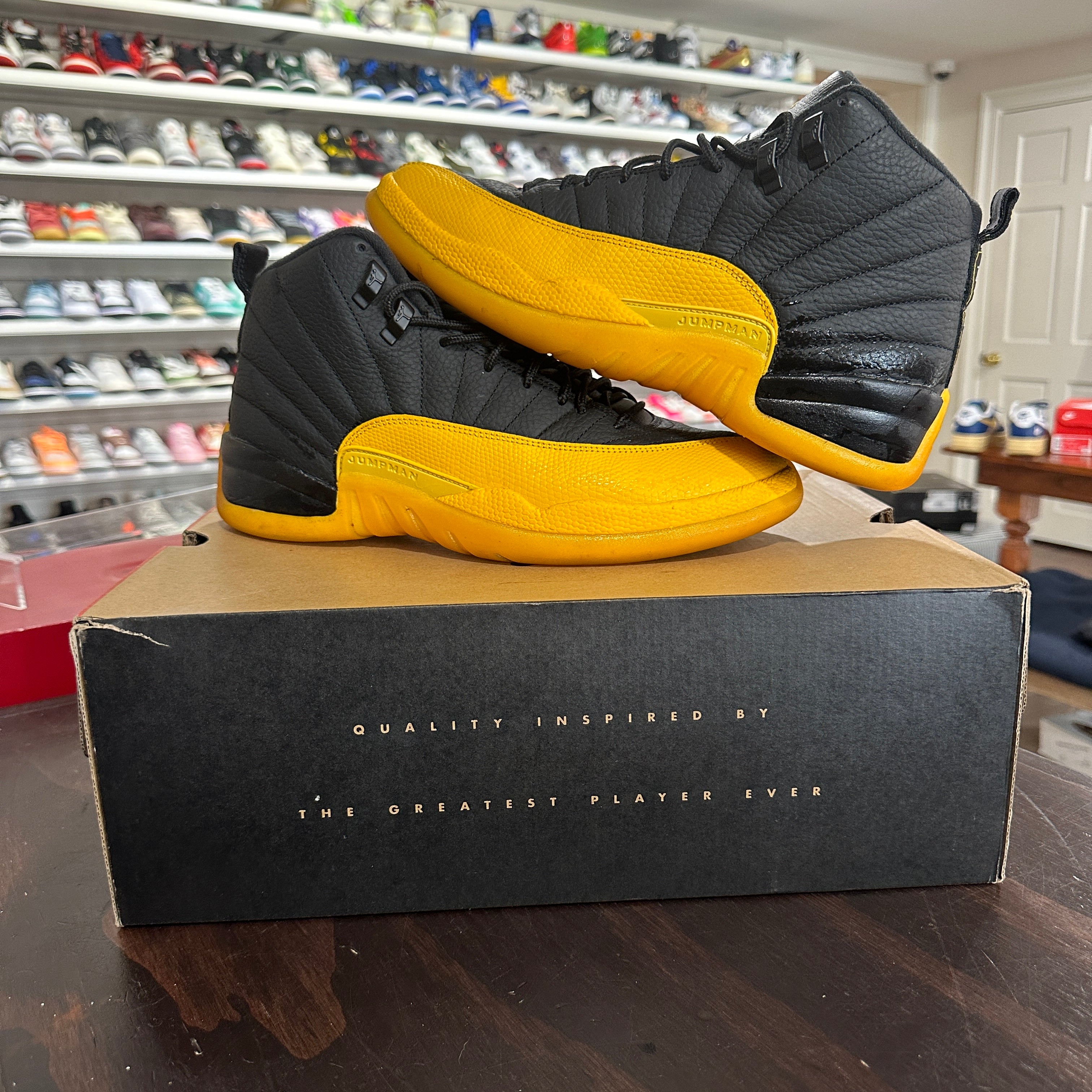 Black and gold jordan 12 shop
