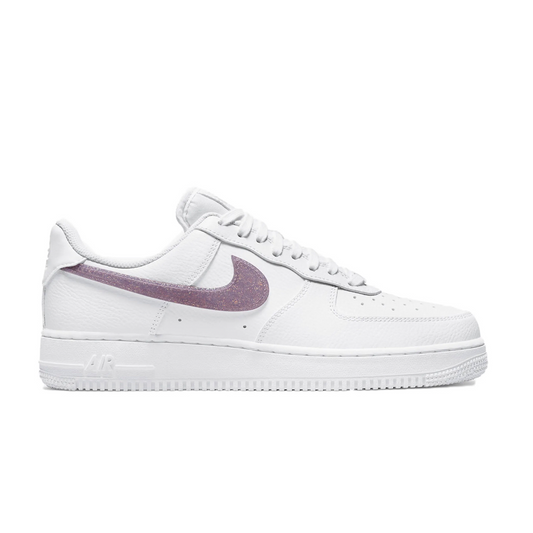 Make a statement in the Nike Air Force 1 Low Glitter Swoosh Purple! This shoe combines a classic style with sparkling glitter and a bold pop of color, perfect for standing out in any crowd. Enjoy the comfort of Nike Air technology with the added Womens twist, letting you walk with confidence and style!