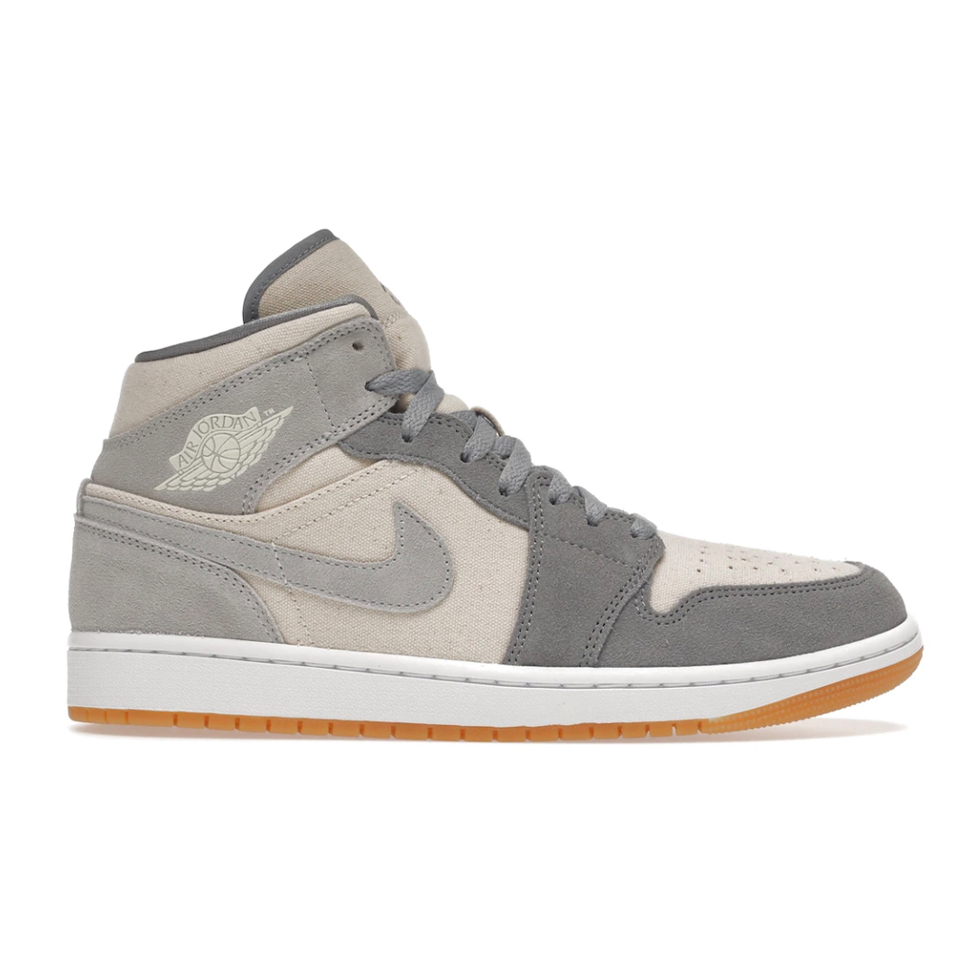 Discover stylish comfort in the Nike Air Jordan 1 Mid SE Coconut Milk Particle Grey. Featuring iconic Air Jordan styling, these sneakers have a striking and timeless appeal. Enjoy superior cushioning with every step taken, no matter the occasion. Upgrade your footwear collection with this celebrated classic.