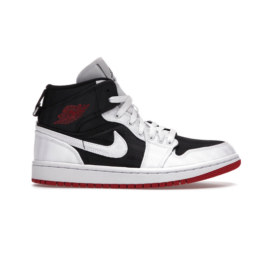 The Nike Air Jordan 1 Mid SE Utility offers classic style with an edge. Featuring a combination of white, black, and red on a comfortable mid-top silhouette, these shoes are perfect for anyone looking to stand out! Delivering great performance and a snug fit, you won't ever have to sacrifice style for comfort.