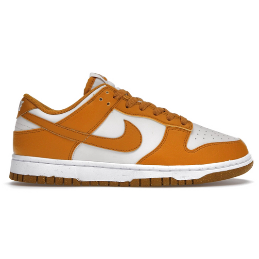 Make a statement in the Nike Dunk Low Next Nature Phantom Gold (Womens) shoes. Featuring a soft velvet upper with a beveled Boost midsole, these are perfect for adding a touch of style to any outfit. Rock the iconic Nike Swoosh and stay comfortable all day in the lightweight design.