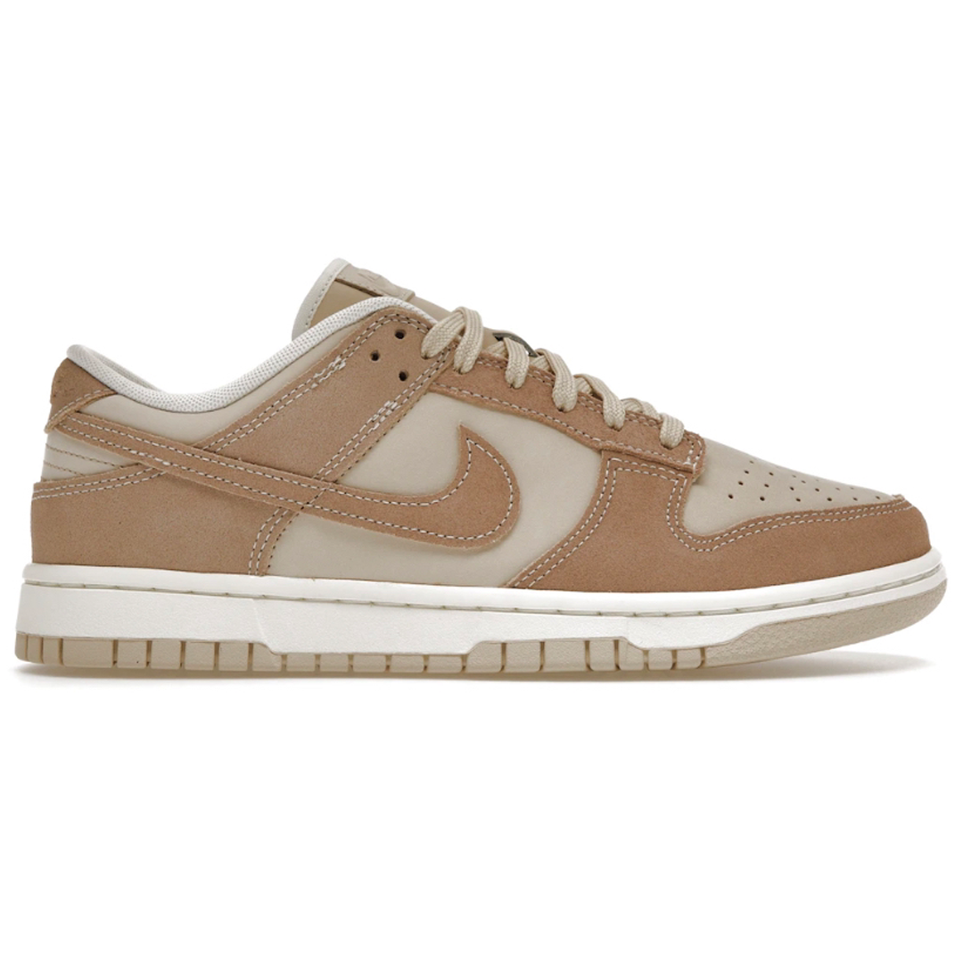 Experience the perfect blend of classic style and modern performance with the Nike Dunk Low SE Sandrift for women. Combining a vintage look with superior cushioning, these sneakers offer ultimate comfort and timeless style. Step out in confidence and take your style to the next level.
