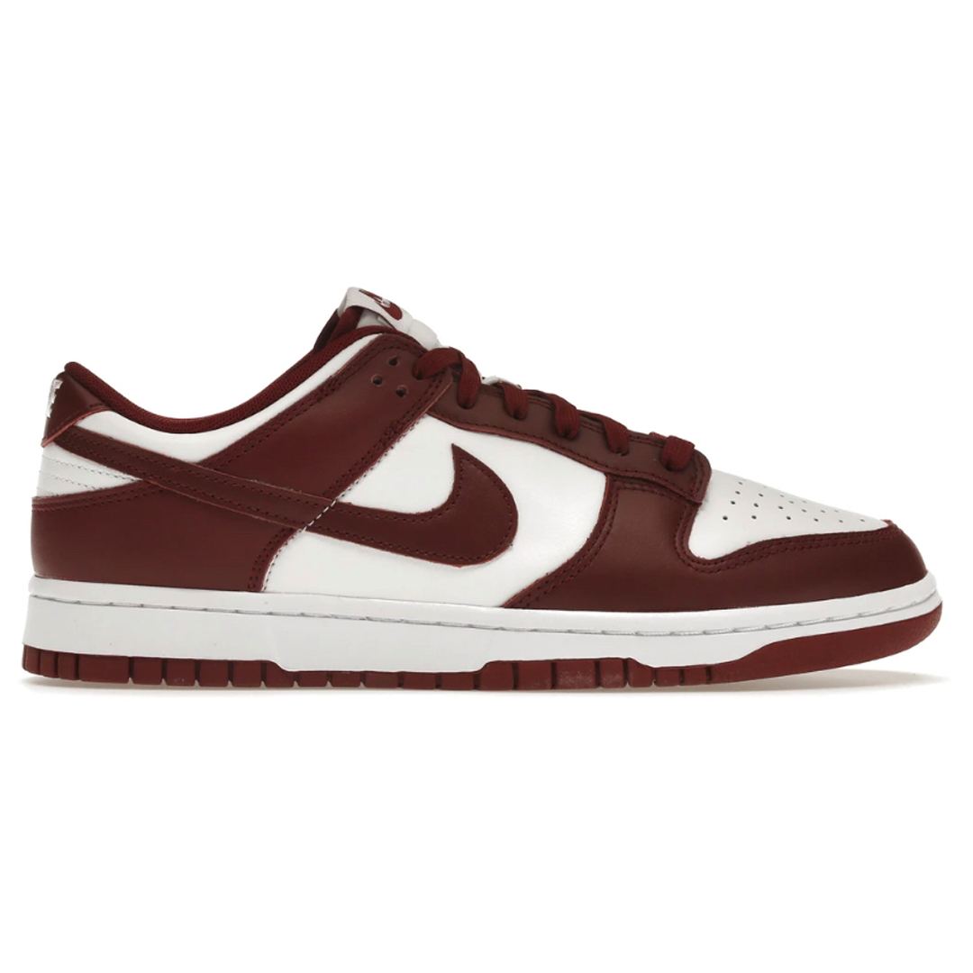 The Nike Dunk Low Team Red (Men's) is a timeless classic for any sneakerhead. It features a sleek, low-cut design perfect for everyday style and the iconic swoosh for added flair. Make a bold statement with these versatile and stylish shoes.