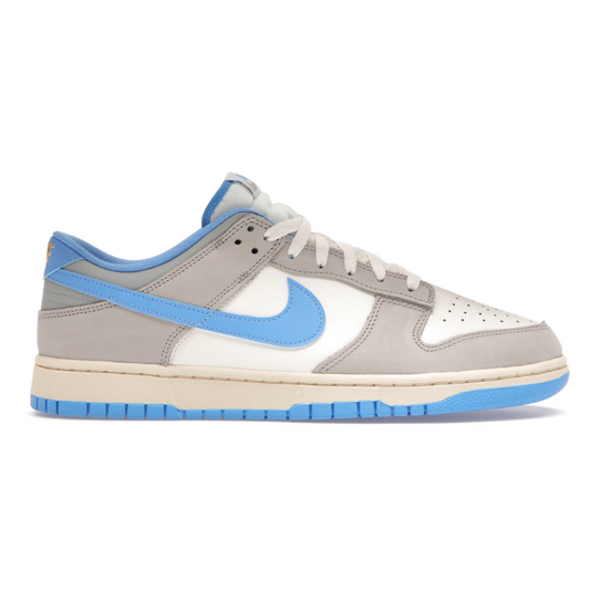 The Nike Dunk Low UNC Athletic Department is an iconic sneaker that strikes a perfect balance between style and comfort. Enjoy the classic, timeless design of this shoe made with premium materials for a comfortable fit. Step out in style with this classic piece.