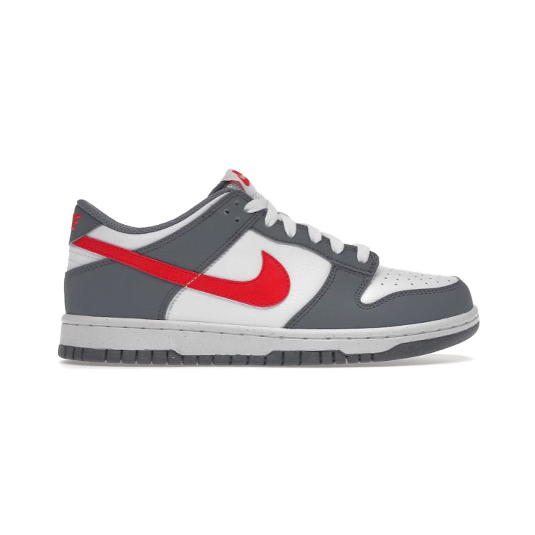The Nike Dunk Low Next Nature Smoke Grey Crimson youth shoe is a stylish and functional footwear choice. The unique shade of grey and subtle crimson accents create a truly eye-catching look, perfect for any occasion. For youth, these shoes offer much more than just style: A durable design and comfortable fit so little feet can move with ease while making a statement.