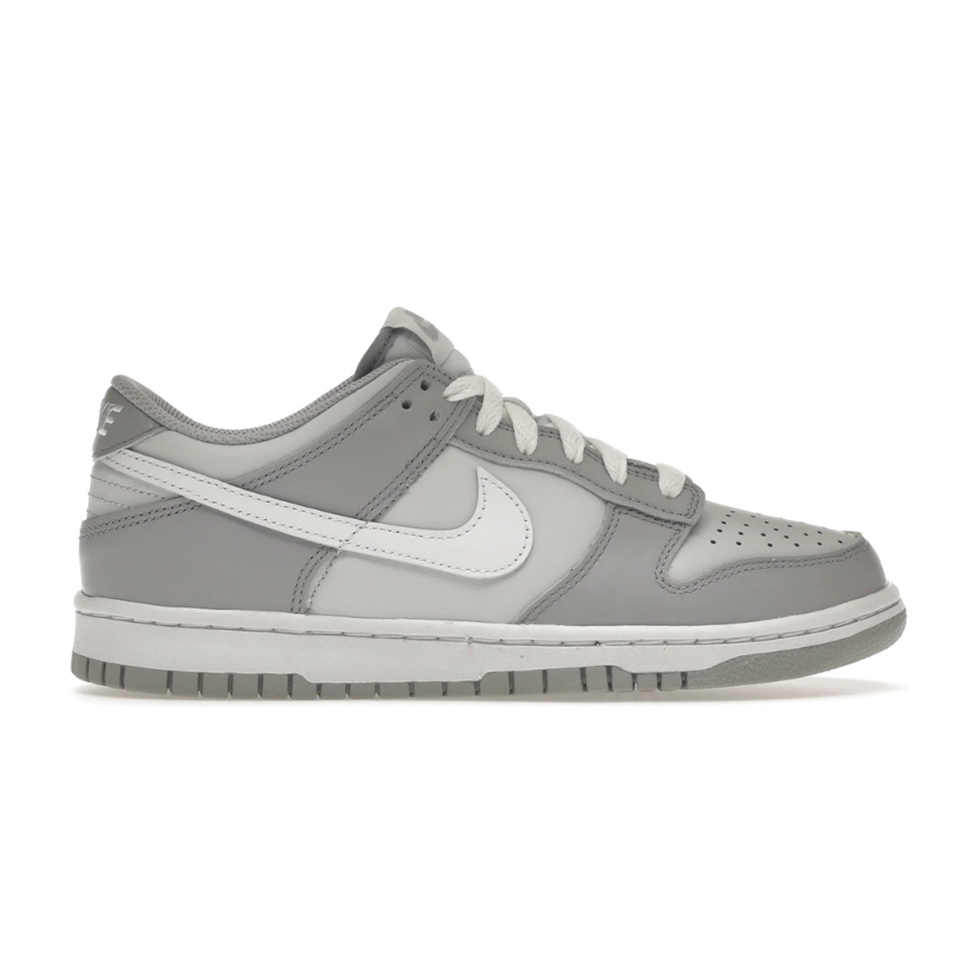 Let your young one stand out with these Nike Dunk Low Two Toned Grey shoes. Featuring a unique two-tone look, the iconic Nike Dunk Low style is sure to turn heads. Perfect for any occasion and any wardrobe, these shoes offer stylish, long-lasting comfort!
