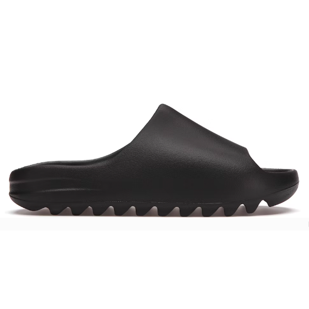 Elevate your street style with the Yeezy Slide Onyx Black. This lightweight shoe combines athletic luxury with an iconic design, perfect for making a statement. Crafted with a plush, water-resistant upper, this shoe offers superior style and comfort without compromising on quality. Show off your unique personal style with the Yeezy Slide Onyx Black.